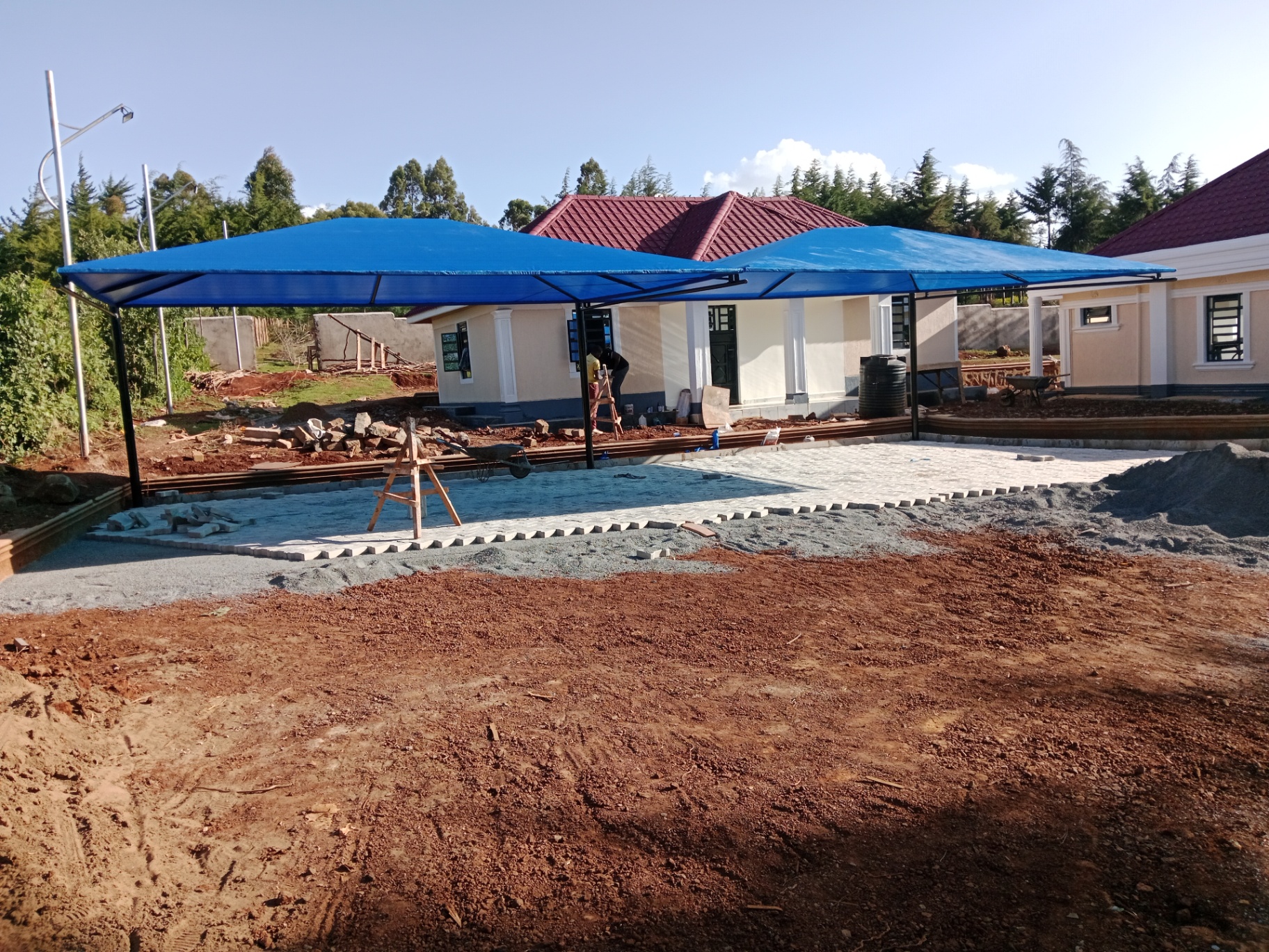 Residential driveway after decorative car shade installation